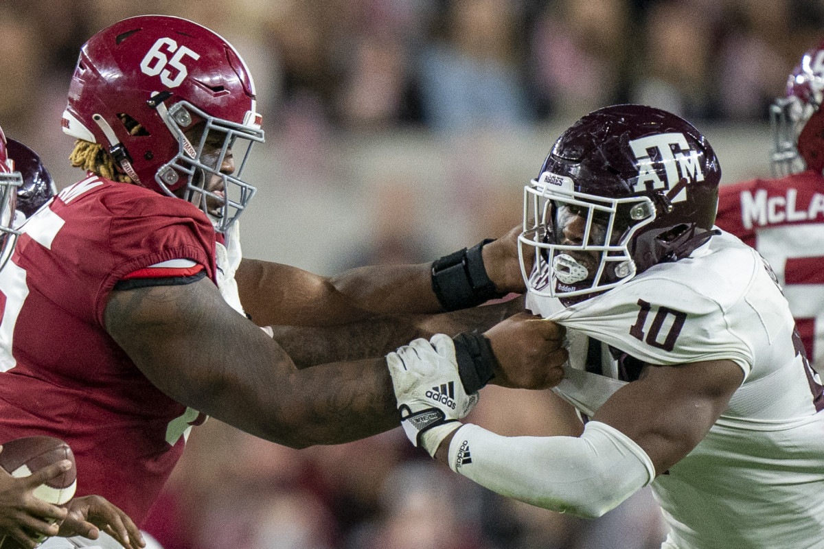 Oct 8, 2022; Tuscaloosa, Alabama, USA; Alabama Crimson Tide offensive lineman JC Latham (65) blocks Texas A&M Aggies defensive lineman Fadil Diggs (10) during the second half at Bryant-Denny Stadium.